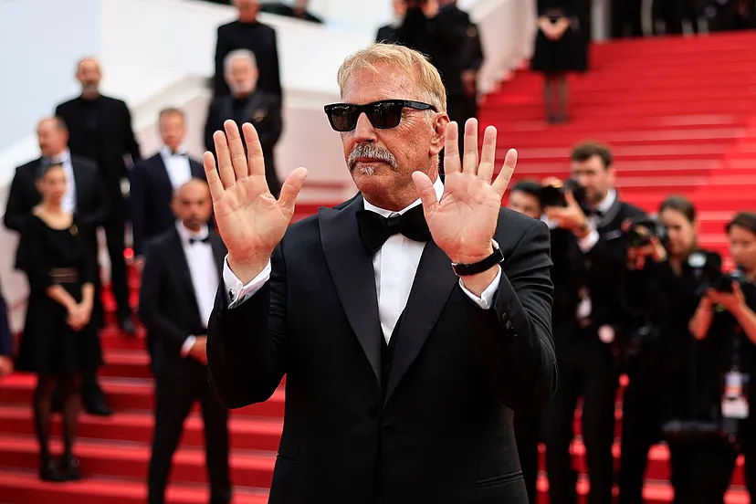 Kevin Costner wears Oliver peoples