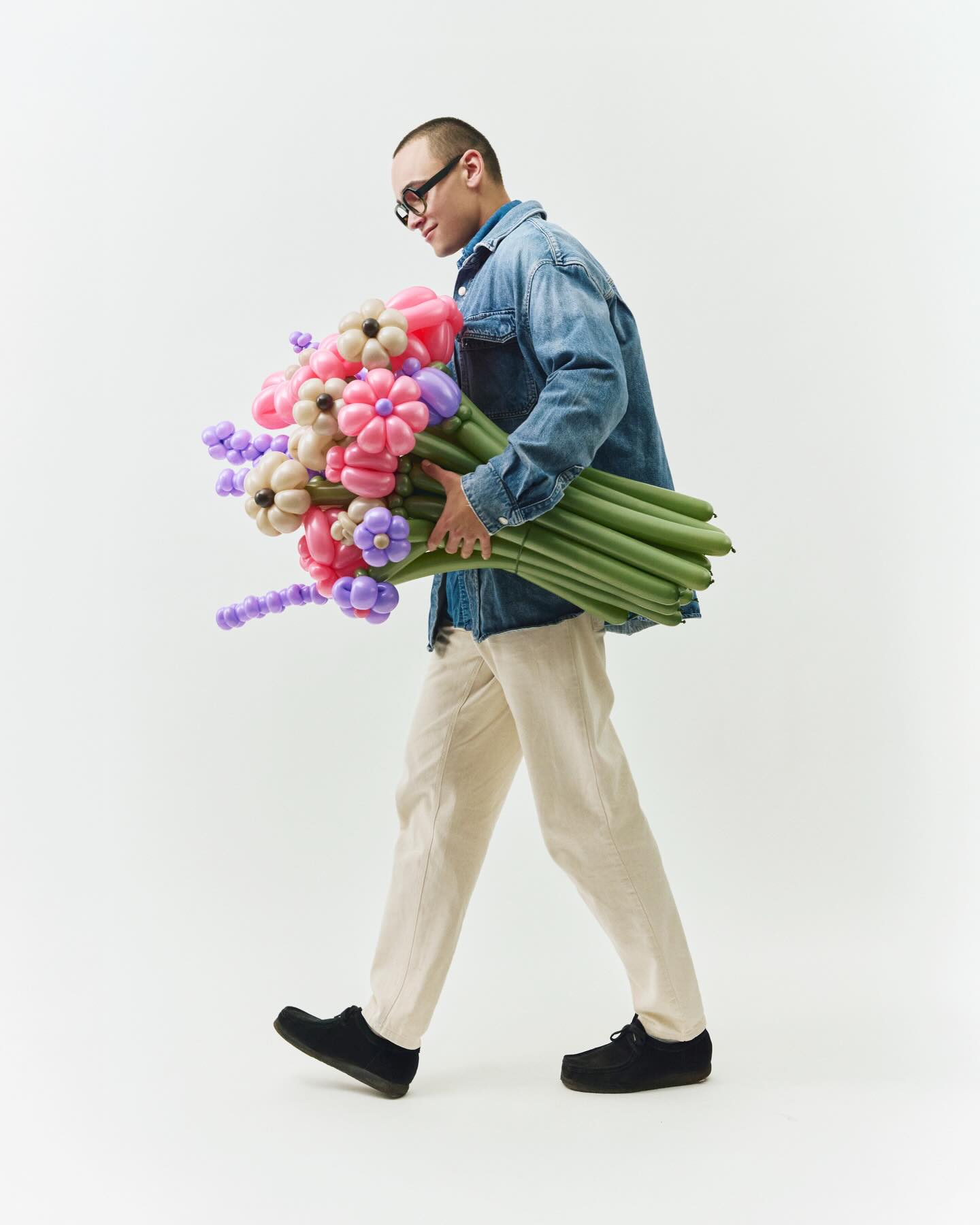 Man in glasses with balloon flowers