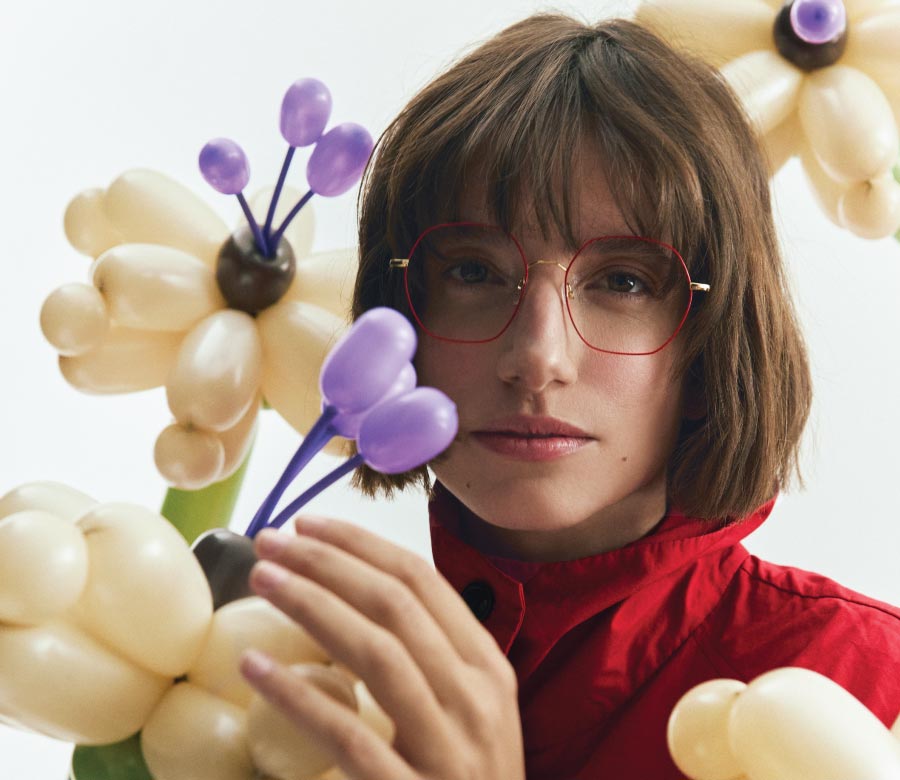 Woman in red metal eyeglasses