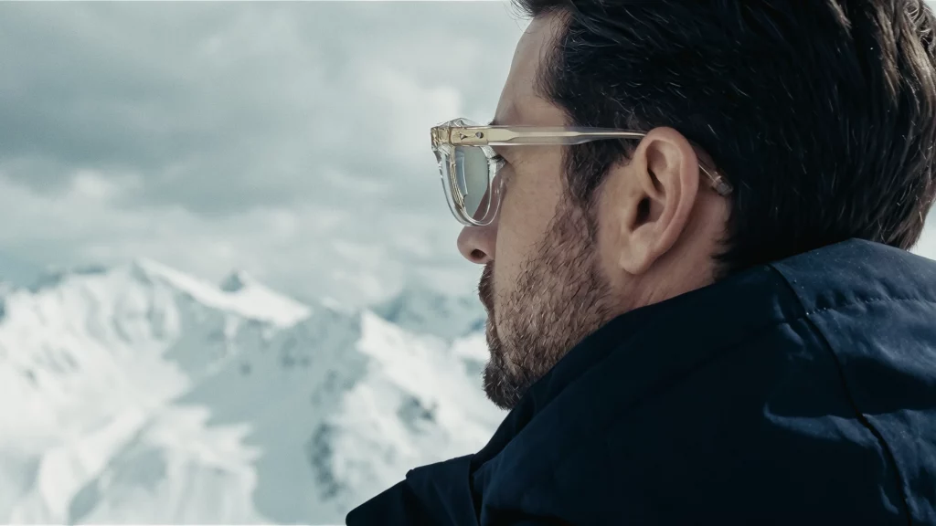 man in Akoni Olympic sunglasses on snow